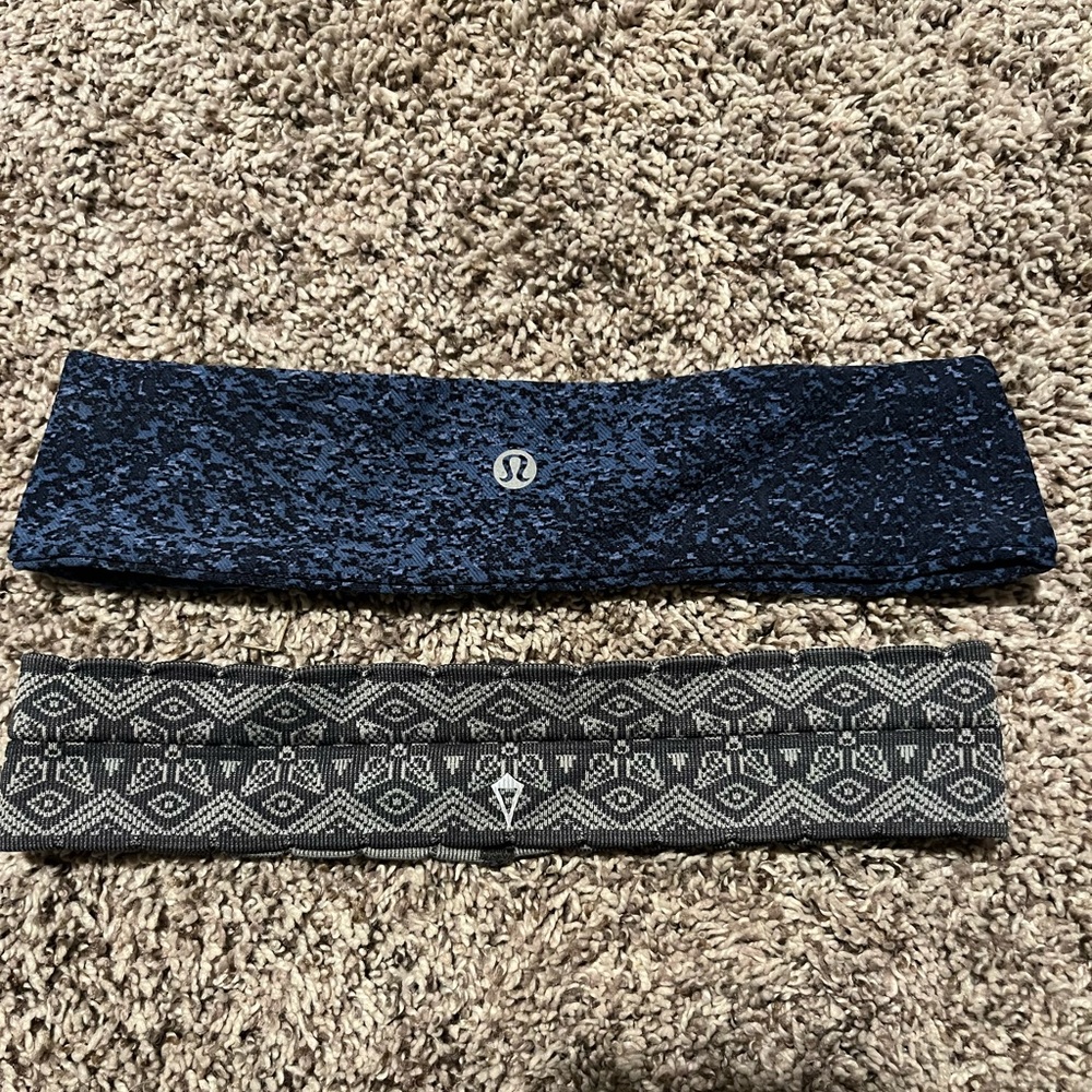 2 headbands / 1 navy blue patterned lululemon / 1 grey patterned ivivva